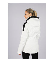 A woman wearing a women’s white insulated jacket with two bold vertical black stripes beside the front zipper and white accents on the hood.