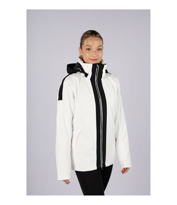 A woman wearing a women’s white insulated jacket with two bold vertical black stripes beside the front zipper and white accents on the hood.