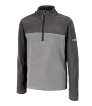 A kids' dark grey and light grey 1/4 zip pullover base layer with a t-neck and blue main zipper, embroidered with a logo on the left sleeve.