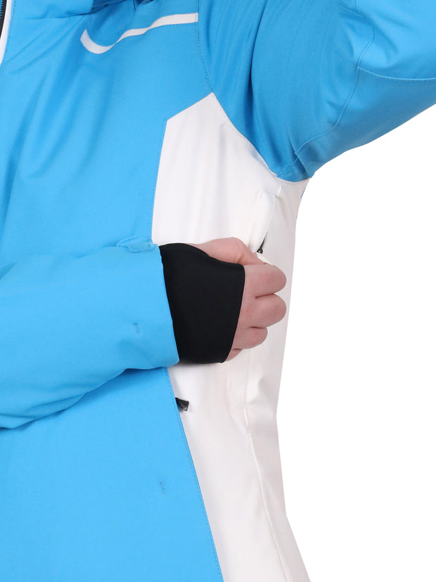 Showing the underarm venting of a woman wearing a blue insulated jacket with a hood, featuring white and black accents with zippered pockets.